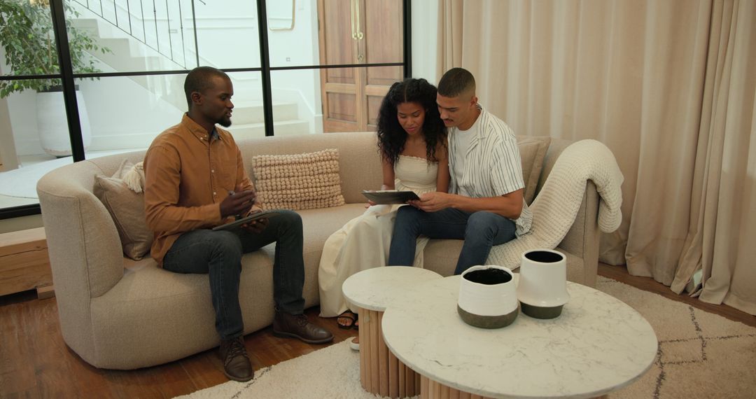 Diverse Couple Consulting at Home with Professional Advisor