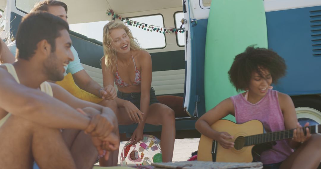 Group of Young Friends Enjoying Beach Trip with Guitar and Camper Van - Free Images, Stock Photos and Pictures on Pikwizard.com