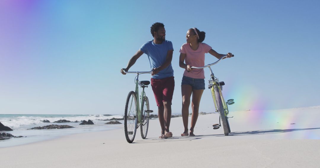 Romantic African American Couple Enjoying Beach Walk with Bicycles