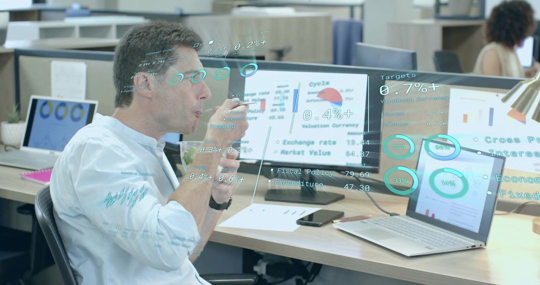 Analyst Reviewing Data Projections with Transparent Charts in Modern Workspace