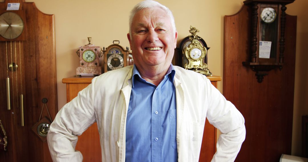 Smiling Horologist Standing in Clocks Workshop