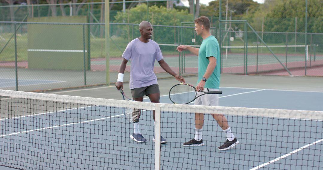 Two Men Shaking Hands on Tennis Court After Game - Free Images, Stock Photos and Pictures on Pikwizard.com