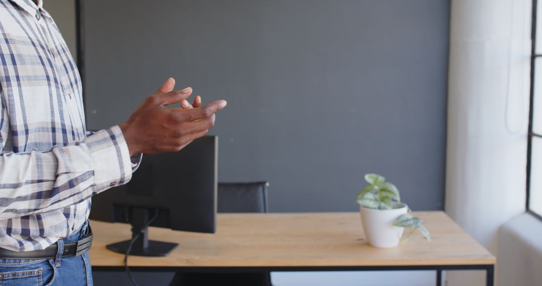 Business Professional Gesturing During Meeting in Modern Office