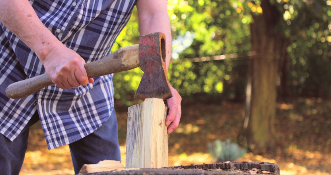 Man Chopping Firewood Outdoors in Autumn - Free Images, Stock Photos and Pictures on Pikwizard.com