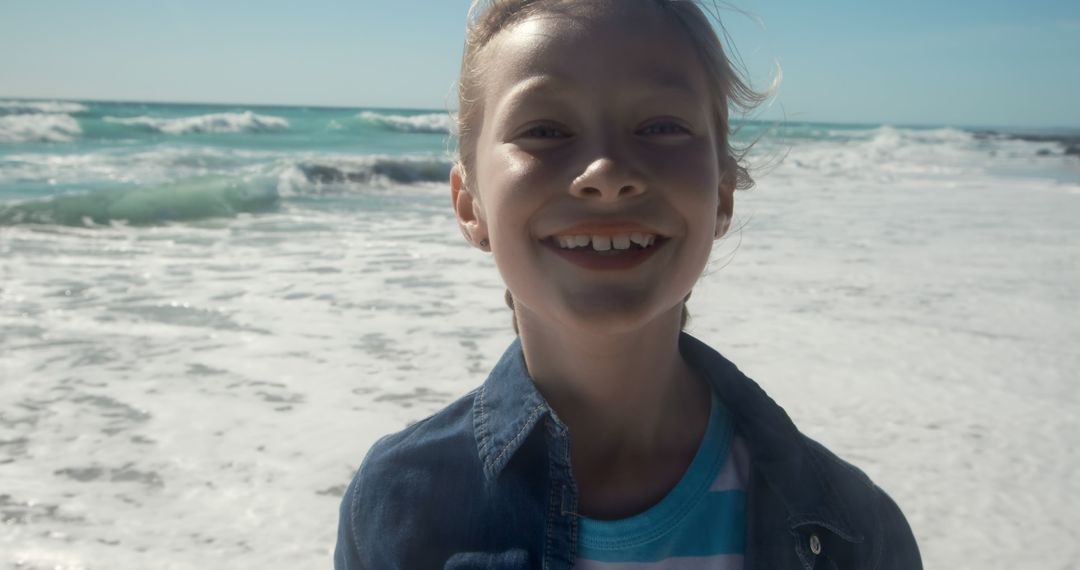 Smiling Boy Enjoying Sunny Day at the Beach - Free Images, Stock Photos and Pictures on Pikwizard.com