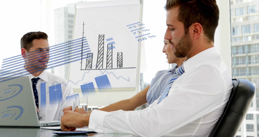 Team Analyzing Graphs and Data in Modern Office