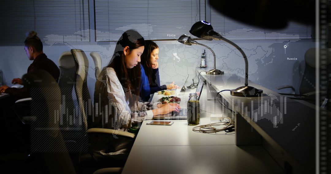 Multitasking Professionals Busy in Tech-Focused Office