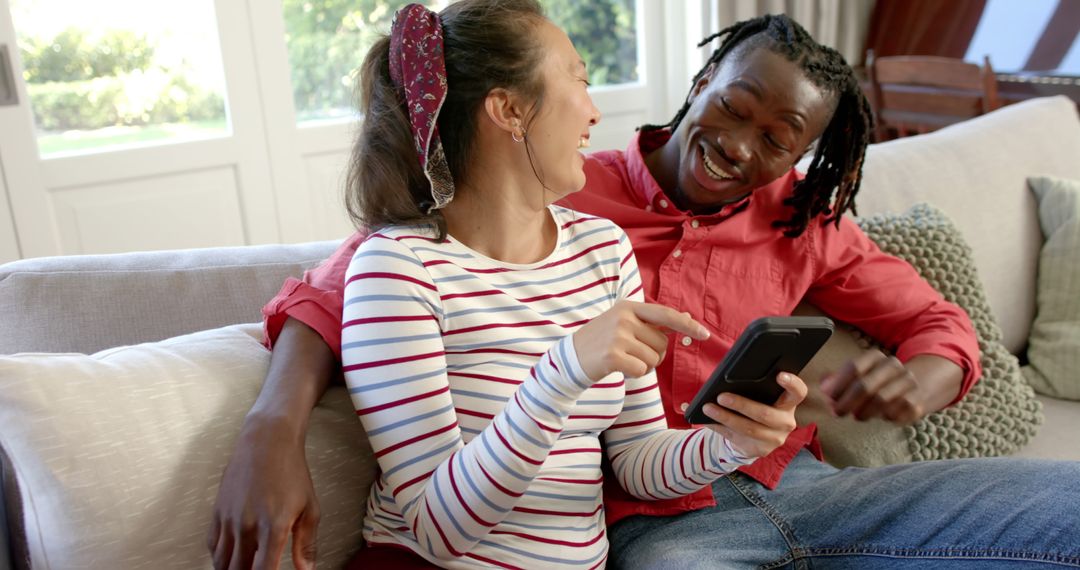 Happy Couple Relaxing on Couch Sharing Togetherness