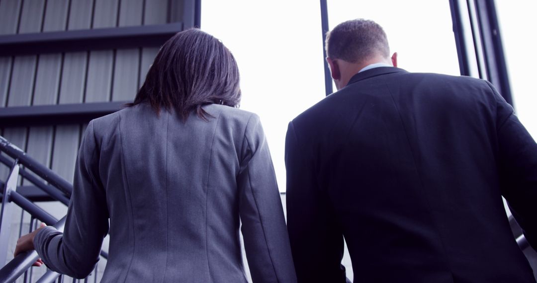 Business Professionals Climbing Stairs During Workday