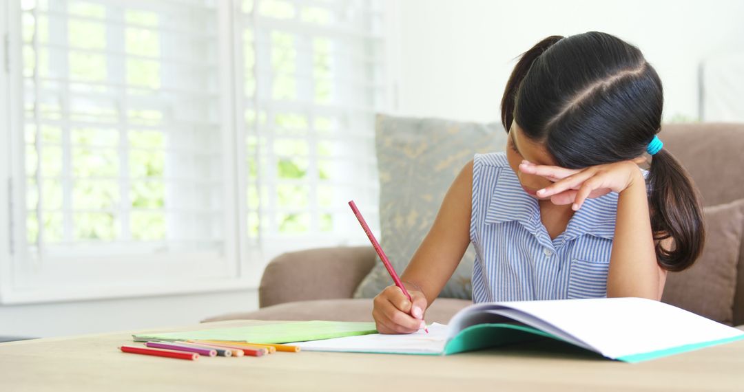 Young Girl Struggling with Homework at Home - Free Images, Stock Photos and Pictures on Pikwizard.com