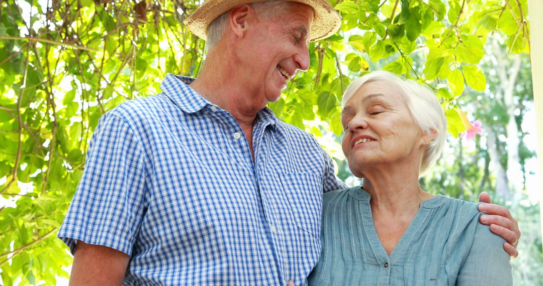 Smiling Senior Couple Enjoying Outdoors in Garden - Free Images, Stock Photos and Pictures on Pikwizard.com