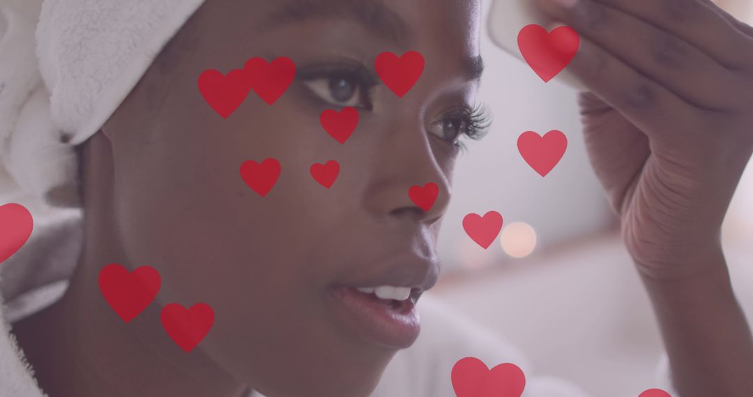Happy Woman Cleansing Face Surrounded by Love Hearts
