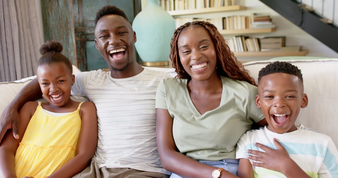 Smiling Family Enjoys Quality Time Together on Couch