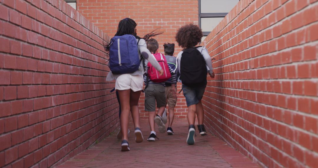 Diverse Children Running with Backpacks to School