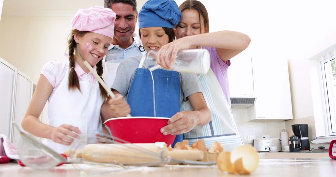 Happy Family Baking Together at Home in Bright and Cozy Kitchen - Free Images, Stock Photos and Pictures on Pikwizard.com