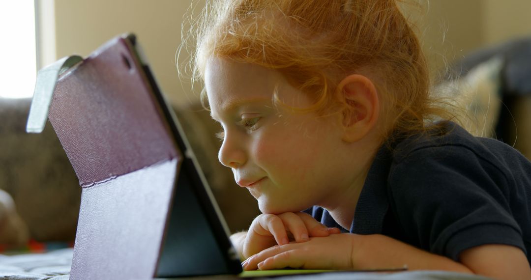 Young Girl Engrossed with Educational Tablet Content - Free Images, Stock Photos and Pictures on Pikwizard.com