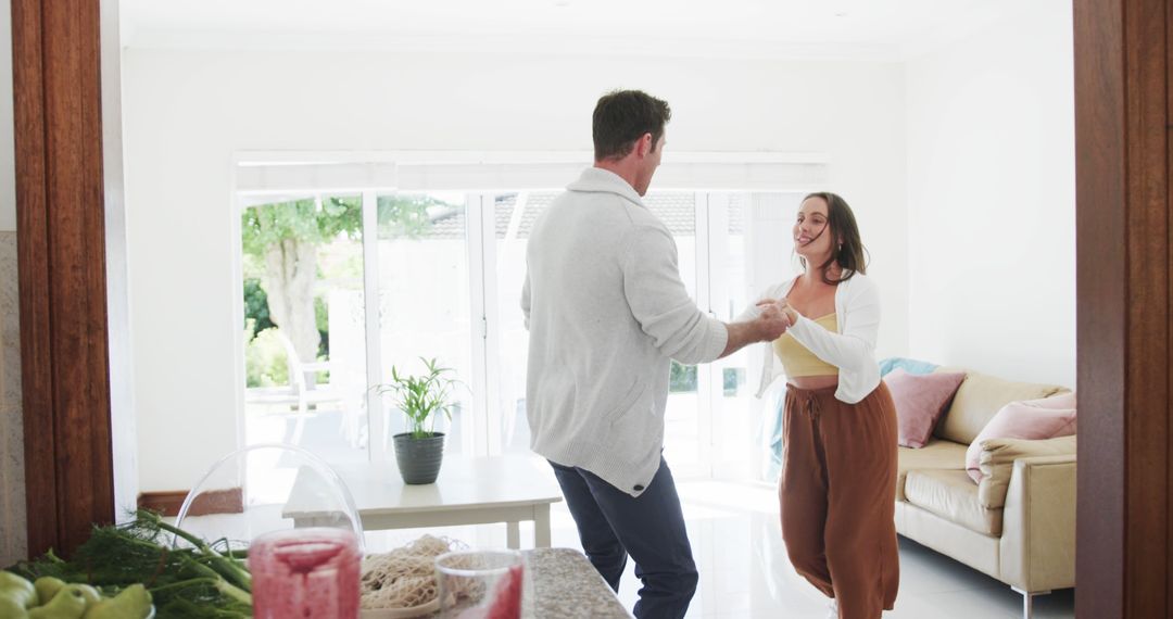 Joyful Couple Dancing Together at Home