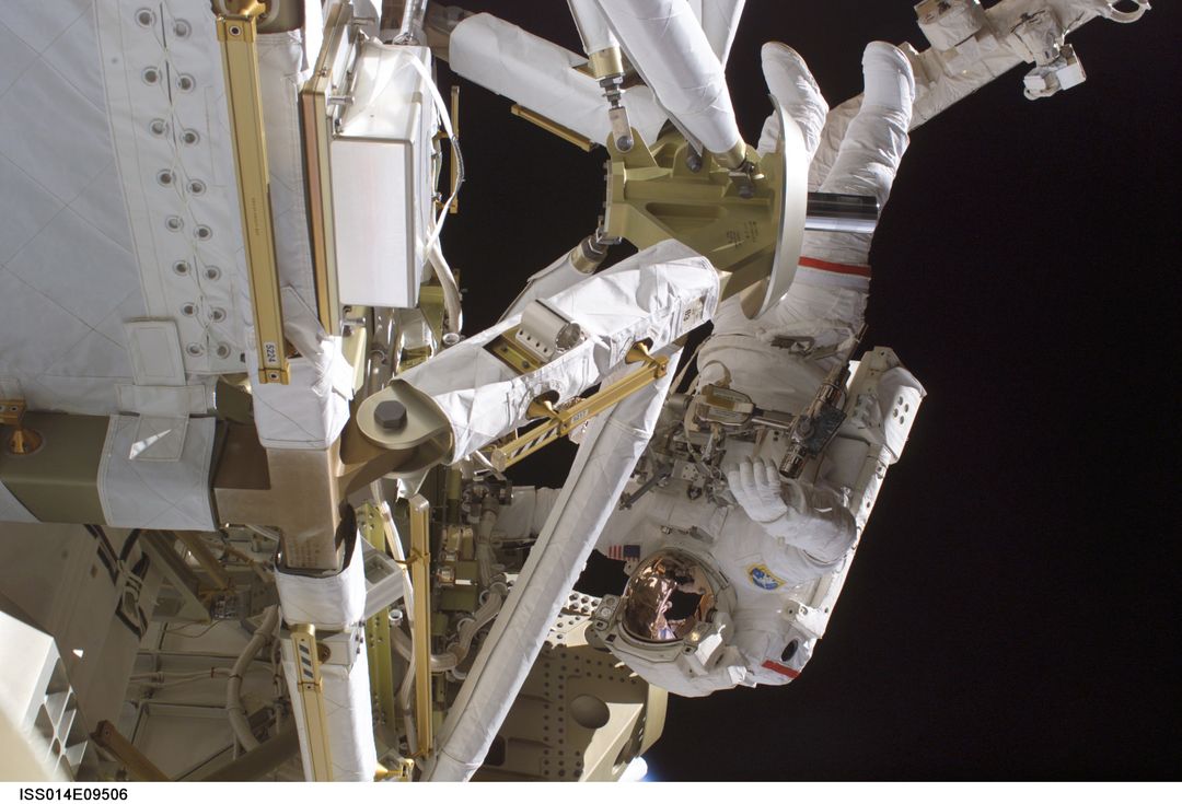 Astronaut Performing Spacewalk to Construct International Space Station - Free Images, Stock Photos and Pictures on Pikwizard.com