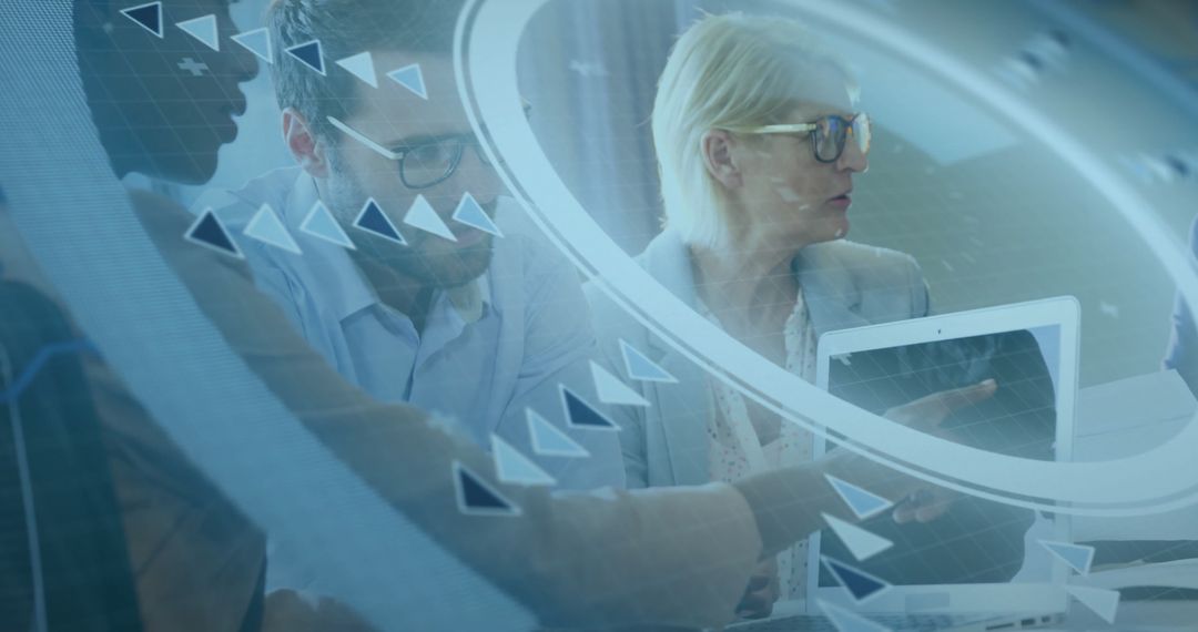 Business Professionals Analyzing Data on Laptop with Futuristic Graphics