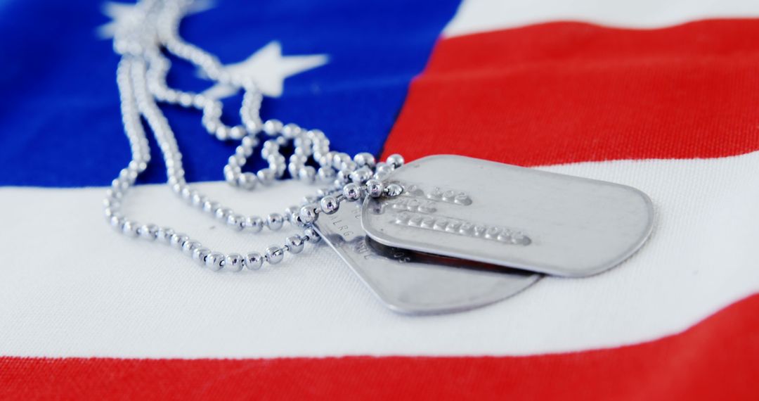 Pair of Military Dog Tags on American Flag Background - Free Images, Stock Photos and Pictures on Pikwizard.com