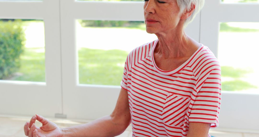 Senior Woman Practicing Mindfulness Meditation at Home - Free Images, Stock Photos and Pictures on Pikwizard.com