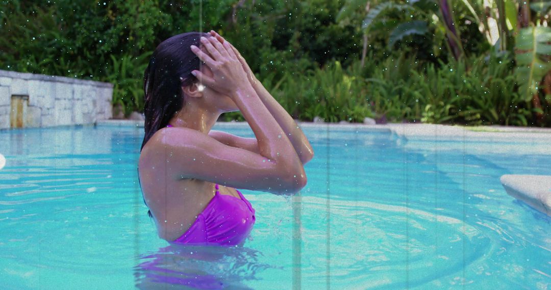 Woman Relaxing in Pool Amidst Exotic Greenery