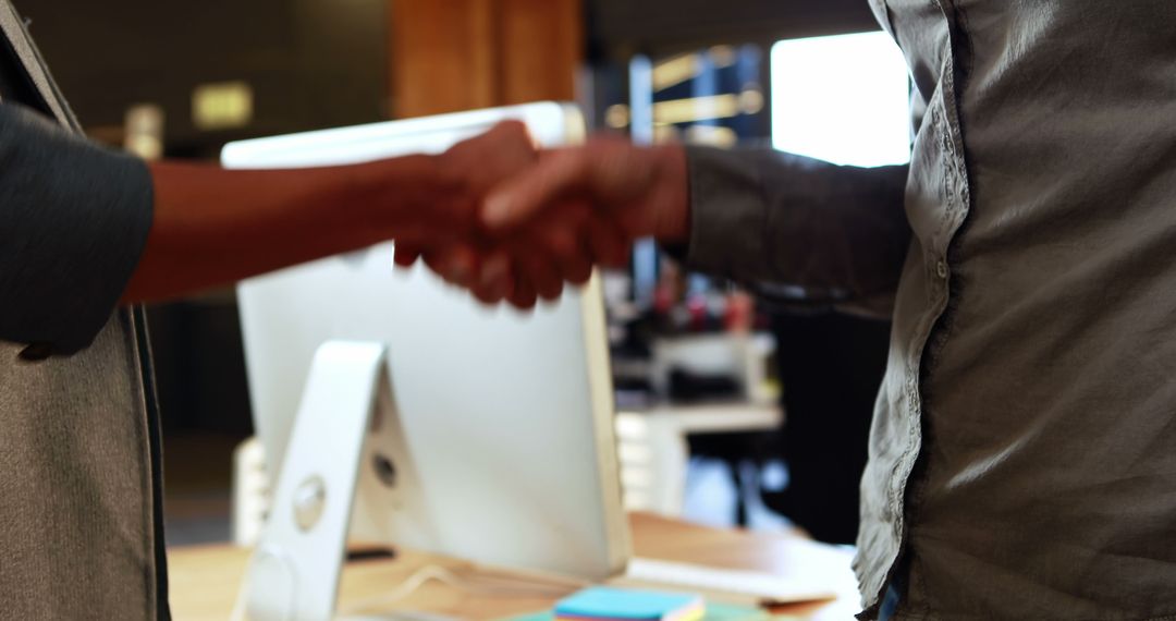 Business People Shaking Hands in Office - Free Images, Stock Photos and Pictures on Pikwizard.com