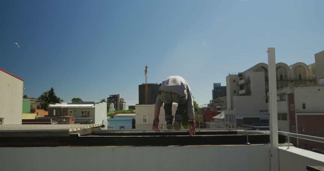 Construction Worker Preparing for the Day on Rooftop - Free Images, Stock Photos and Pictures on Pikwizard.com