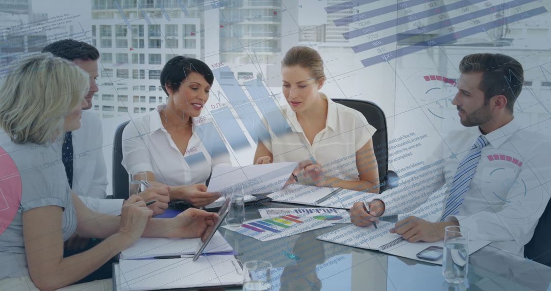 Diverse Team Analyzing Reports in Modern Office Setting