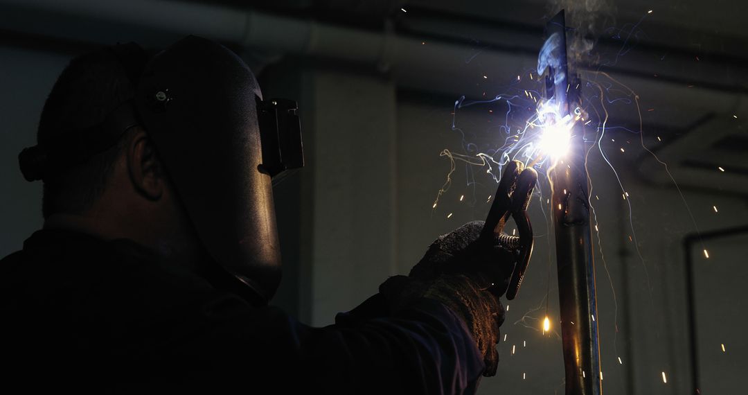 Industrial Welder Working with Spark Show Outdoors - Free Images, Stock Photos and Pictures on Pikwizard.com