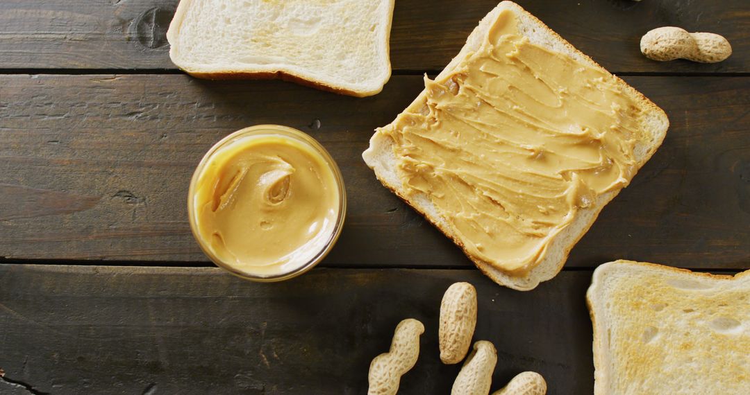 Toasted Bread with Creamy Peanut Butter and Peanuts