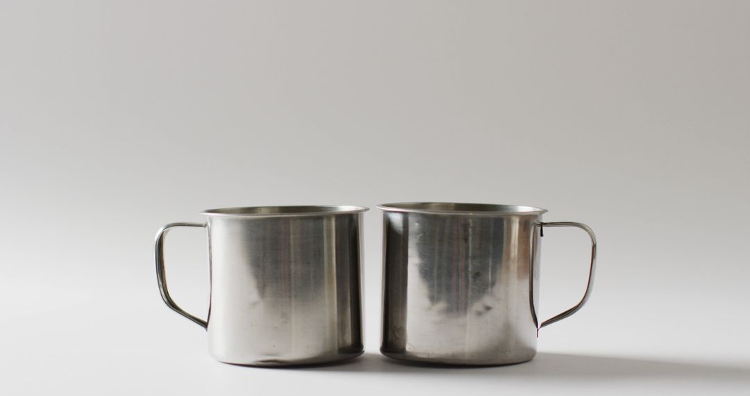 Two Stainless Steel Cups on White Background - Free Images, Stock Photos and Pictures on Pikwizard.com