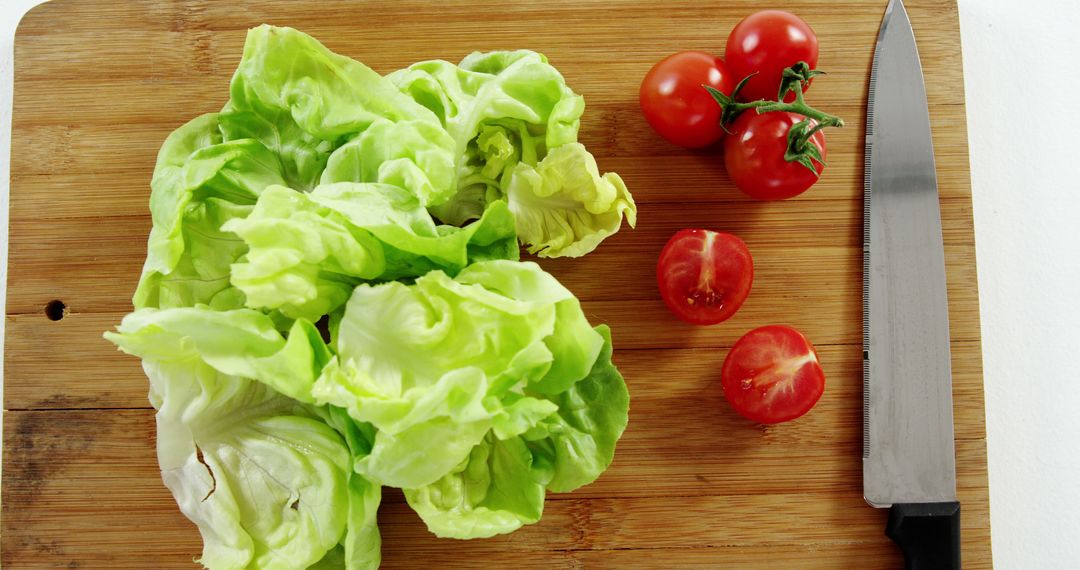 Fresh Lettuce and Tomatoes on Cutting Board - Free Images, Stock Photos and Pictures on Pikwizard.com