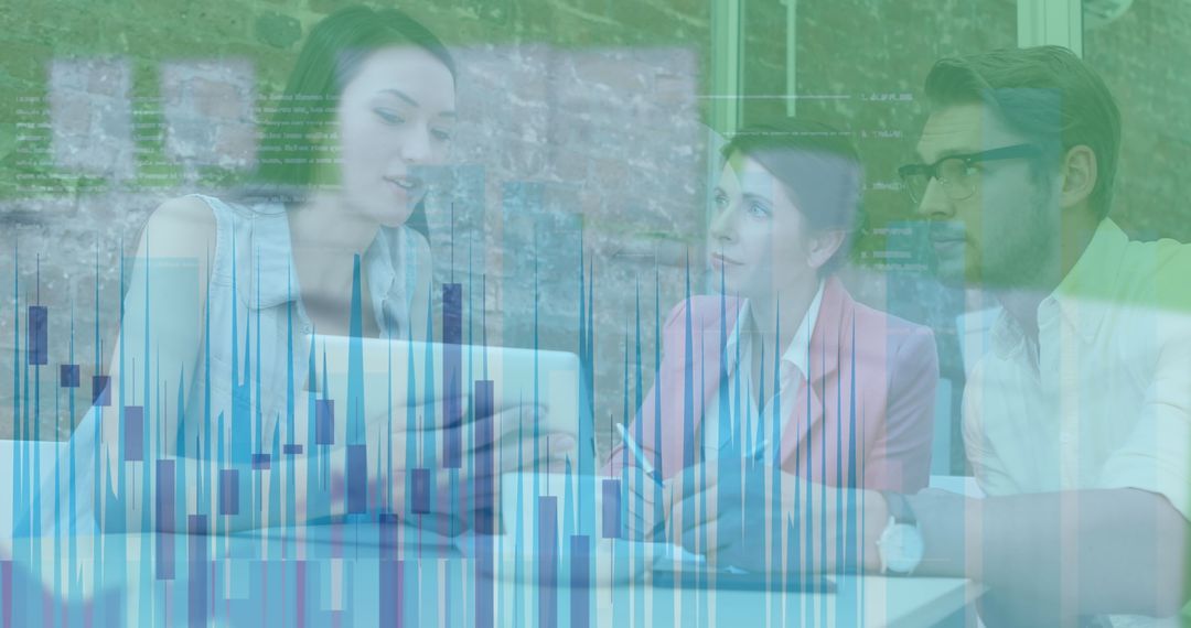 Colleagues Analyzing Data Over Tablet in Modern Office Environment