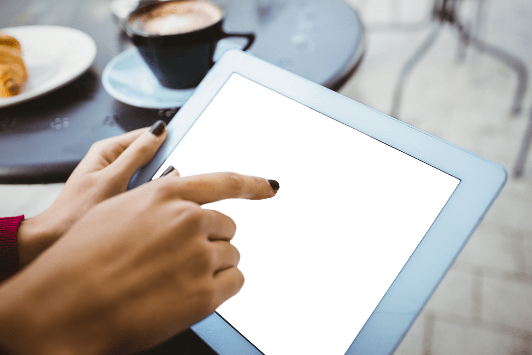 Woman's Hands Touching Transparent Tablet Screen at Cafe