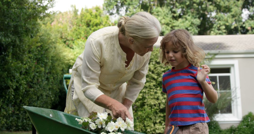 Grandmother Bonding with Granddaughter Through Gardening - Free Images, Stock Photos and Pictures on Pikwizard.com