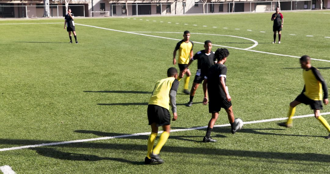 Youth Soccer Players Competing on Field in Intense Game
