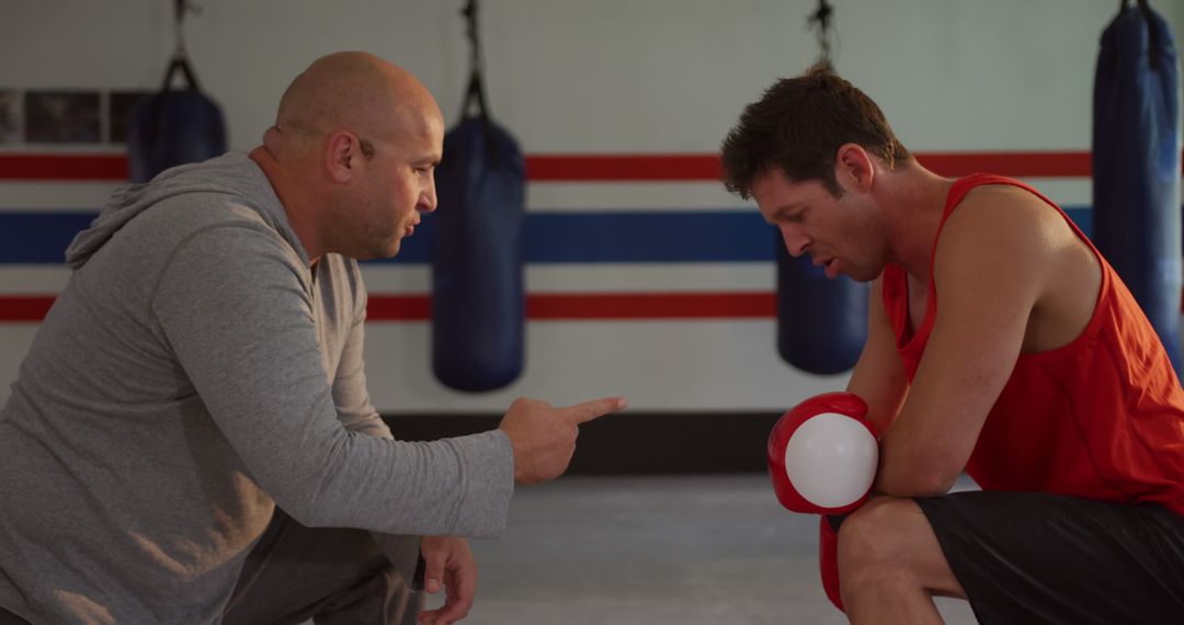 Boxing Coach Motivating Tired Boxer During Training - Free Images, Stock Photos and Pictures on Pikwizard.com