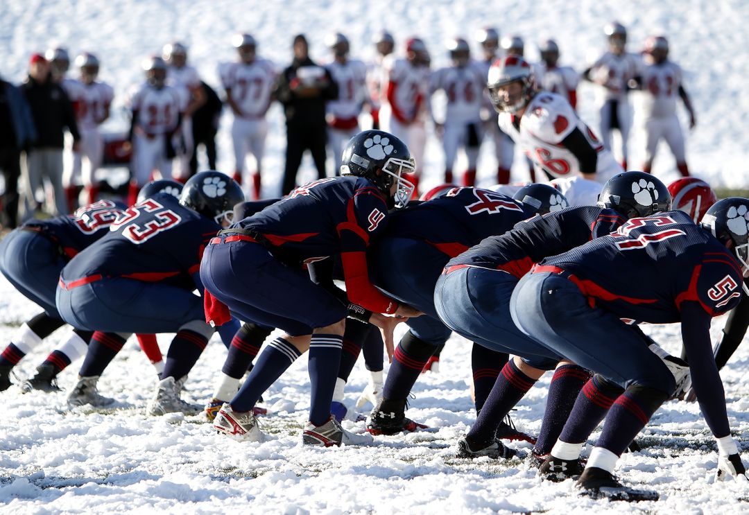 High School Football Teams Competing During Snowy Winter Game - Free Images, Stock Photos and Pictures on Pikwizard.com
