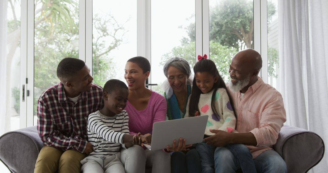 Multi-Generational African American Family Smiling Together on Couch with Laptop - Free Images, Stock Photos and Pictures on Pikwizard.com