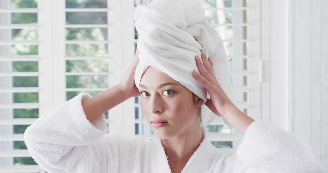 Woman in Bathrobe with Towel Turban in Bright Bathroom - Free Images, Stock Photos and Pictures on Pikwizard.com