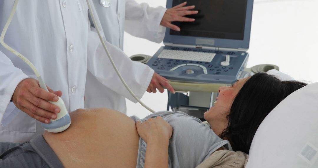 Pregnant Woman Receiving Ultrasound Examination - Free Images, Stock Photos and Pictures on Pikwizard.com