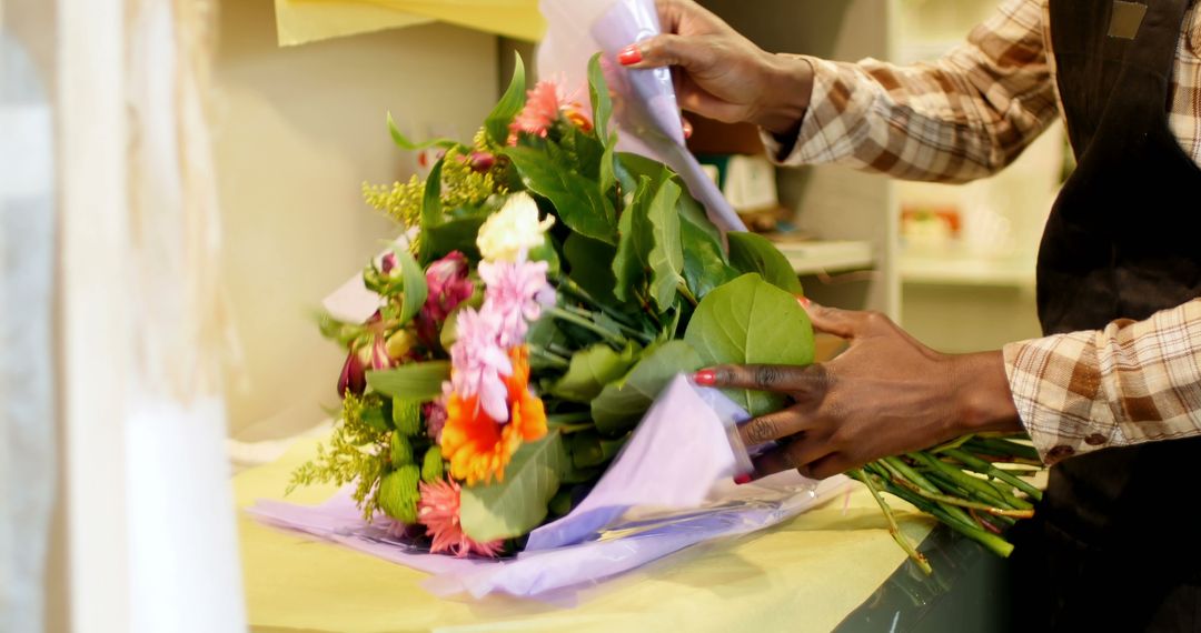 Florist Wrapping Colorful Flower Bouquet in Shop - Free Images, Stock Photos and Pictures on Pikwizard.com