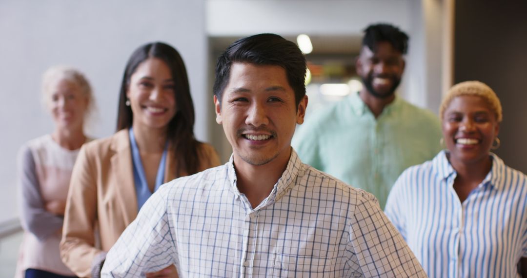 Smiling Diverse Business Teamagers in Office Corridor