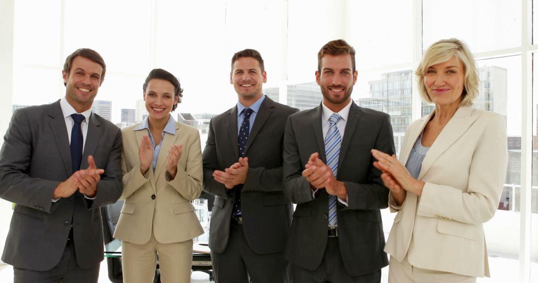 Business Team Clapping Together in Corporate Office - Free Images, Stock Photos and Pictures on Pikwizard.com