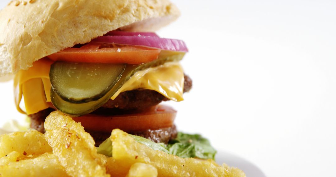 Close-up of Delicious Cheeseburger with Fries on White - Free Images, Stock Photos and Pictures on Pikwizard.com