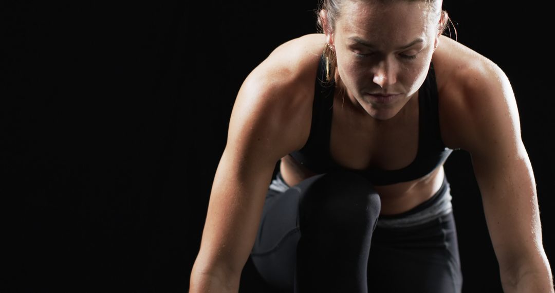 Athlete Preparing for Sprint with Intense Focus and Determination