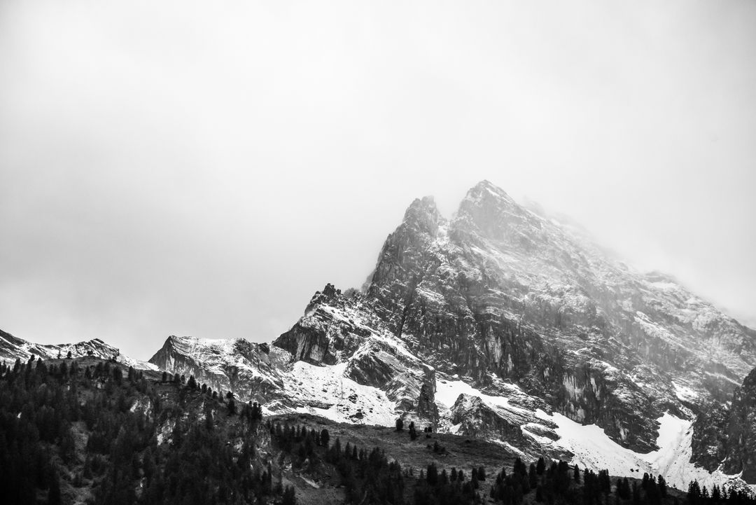 Snow-Capped Mountain Peaks with Misty Clouds in Black and White