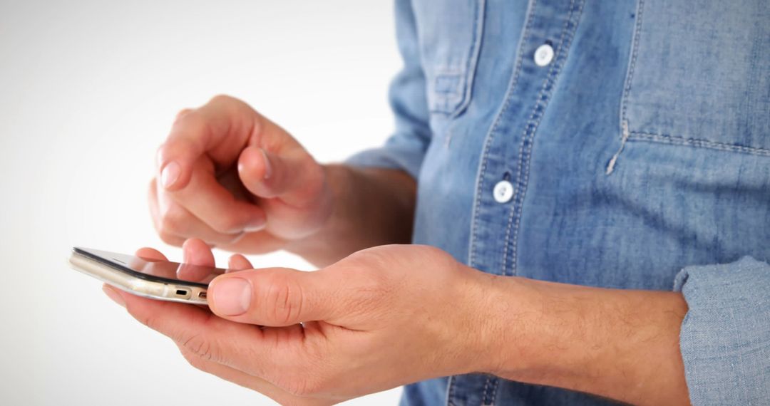 Man Using Smartphone in Casual Denim Shirt