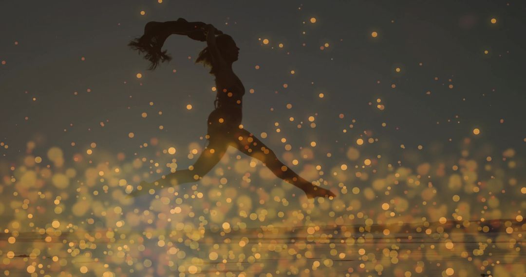 Silhouetted Athlete Leaping Over Lake with Golden Bokeh